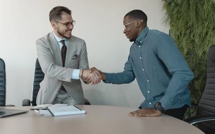 Recruitment agency shaking hands with a candidate they just hired