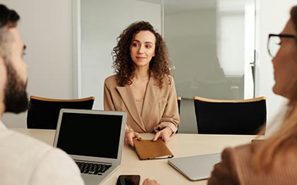 business woman sitting in a boardroom